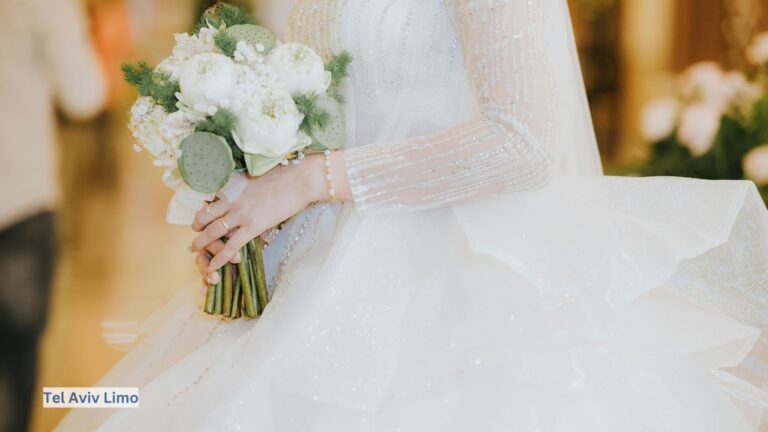 Closeup of an elegant bride holding her bouquet before stepping into a luxury limousine